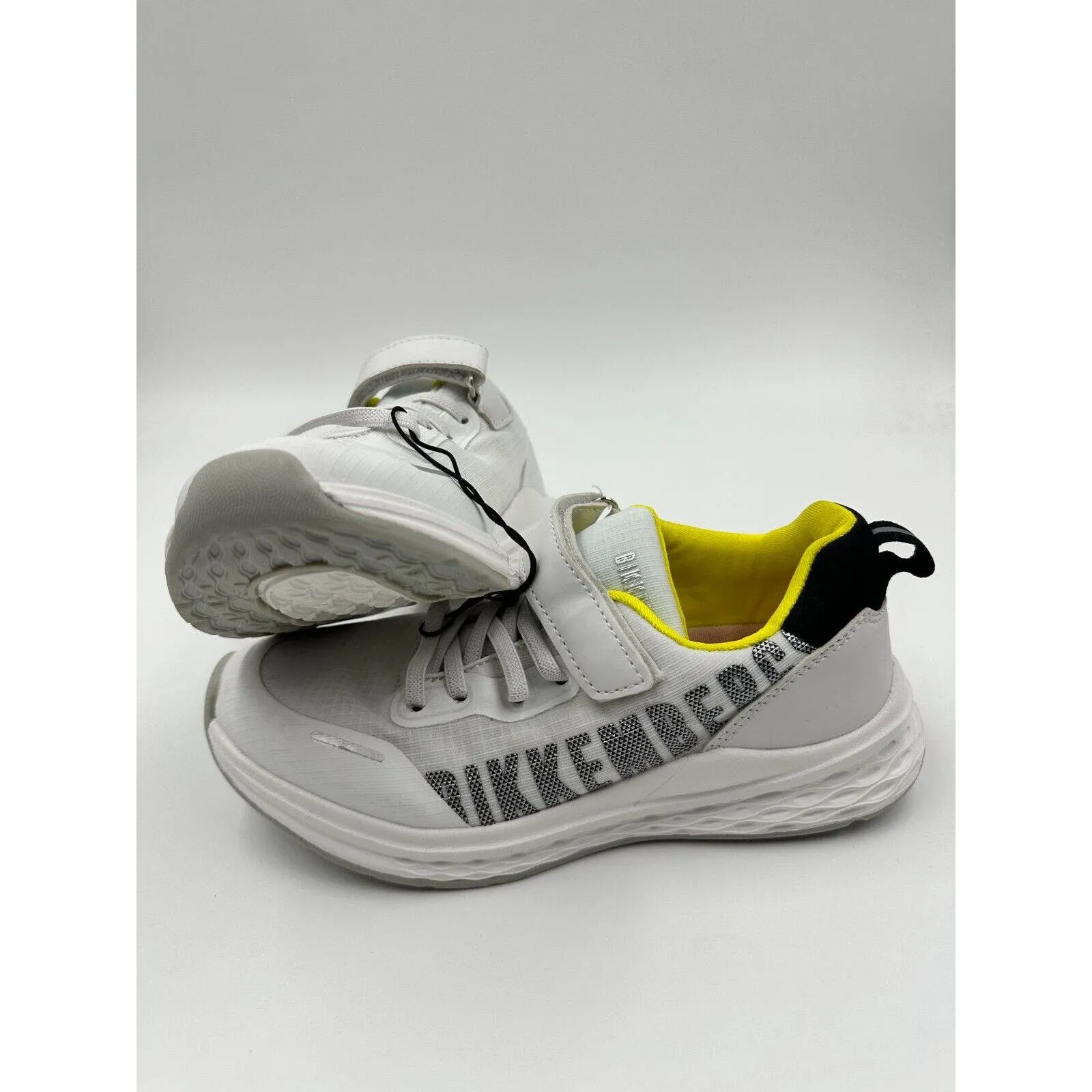 Big Kids Size 4 white and yellow running sneakers