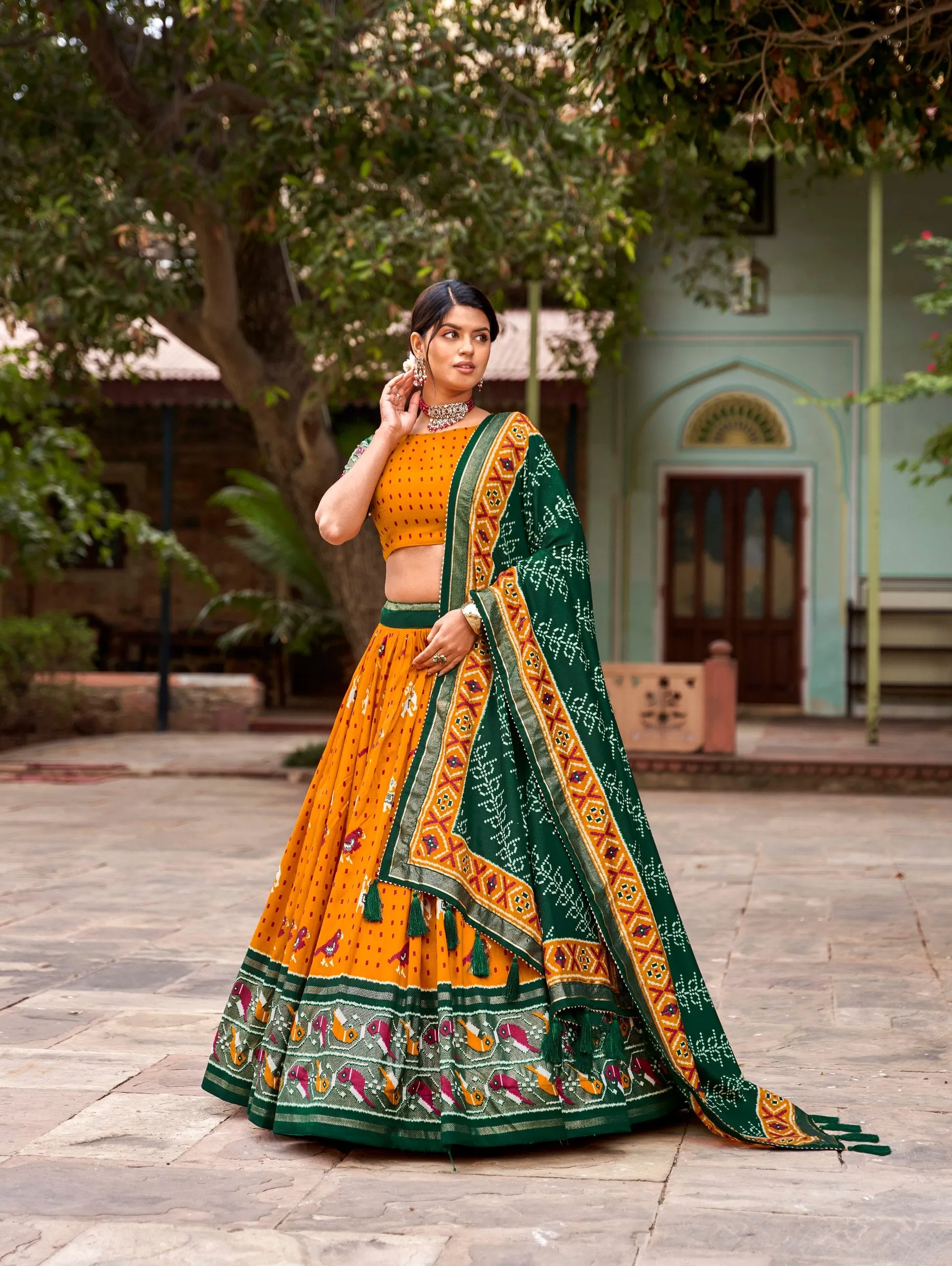 Mustard Tussar Silk Lehenga Choli with Enchanting Ikat Patola Print and Foil Work